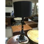 A Regency style table lamp painted black and iverl