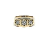 A gents 9ct gold gypsy ring set with three diamond