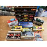 A collection of boxed diecast vehicles including c