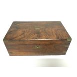 A walnut writing box with brown leather interior a