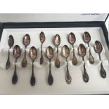 A cased set of 12 spoons marked 800