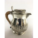 A fine, Walker and Hall, London silver jug with ga