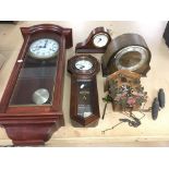 A collection of wall and mantle clocks