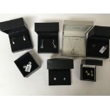 A collection of boxed silver and gold jewellery in fitted boxes.