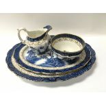 An extensive collection of blue and white willow pattern dinner service.