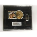 A limited edition framed and glazed gold plated CD