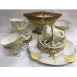 An Art Deco coffee set and a painted Myott flower