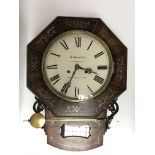 A 19th century wall clock with brass and pewter in