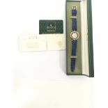 A Gucci Midi Watch with a blue chapter ring and st