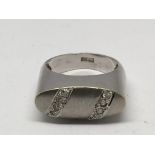 An Egyptian white gold ring of elongated shape set