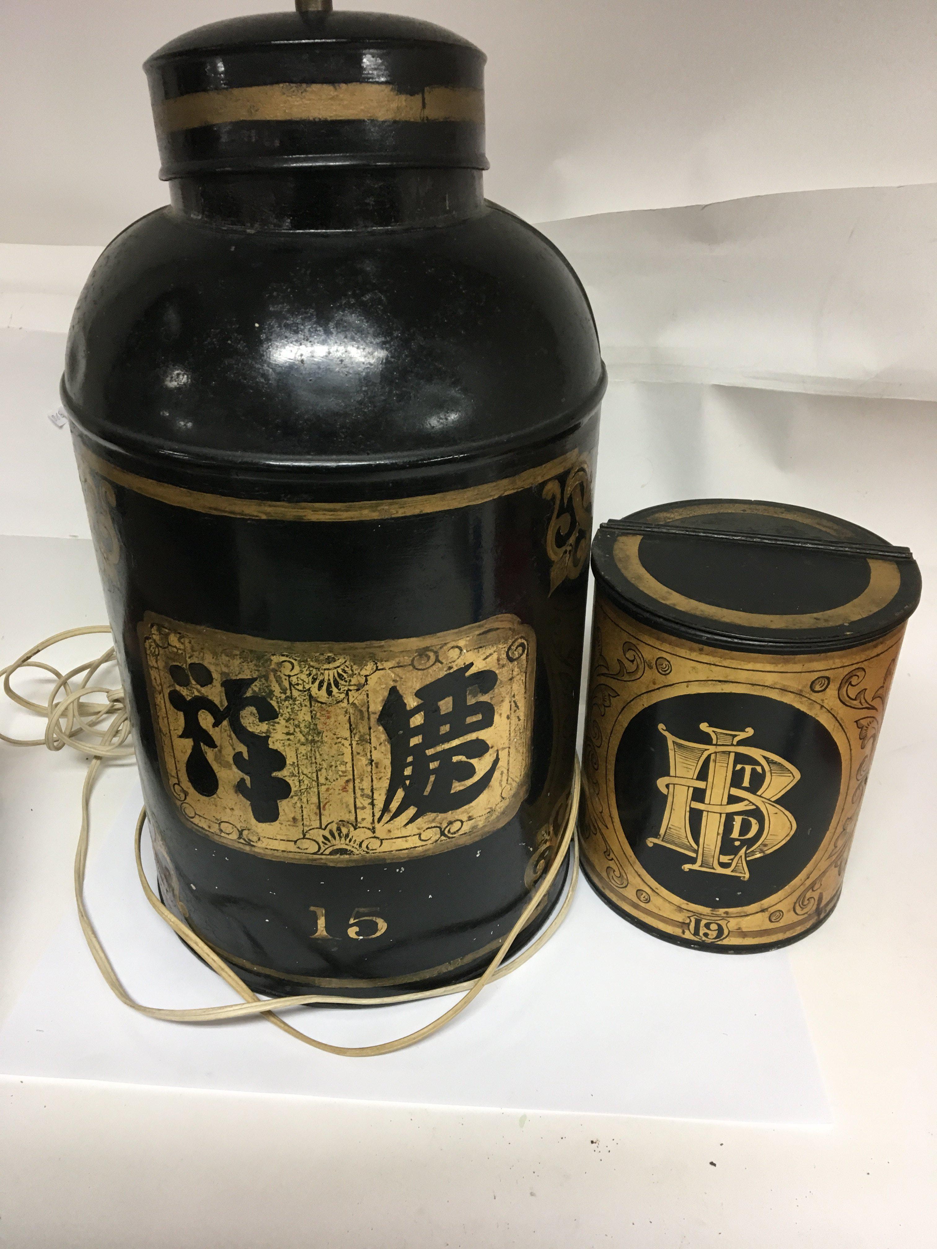 A Chinese tea caddy converted to a table lamp and one other tea container