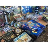 A collection of boxed board games and toys includi