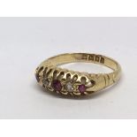 An 18ct gold ring set with rubies and diamonds. Ap