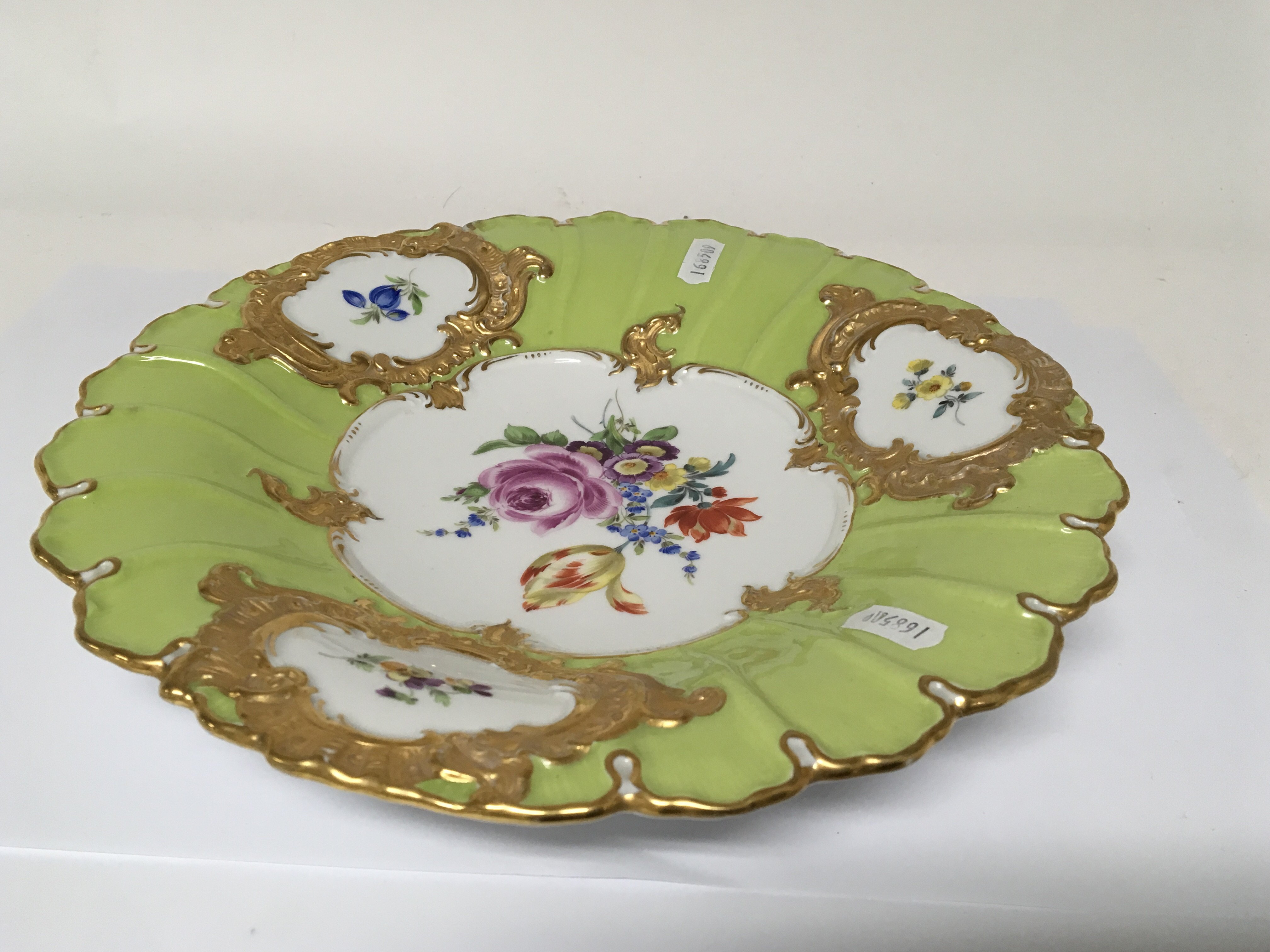 A Meissen porcelain plate with hand painted porcel