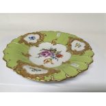 A Meissen porcelain plate with hand painted porcel