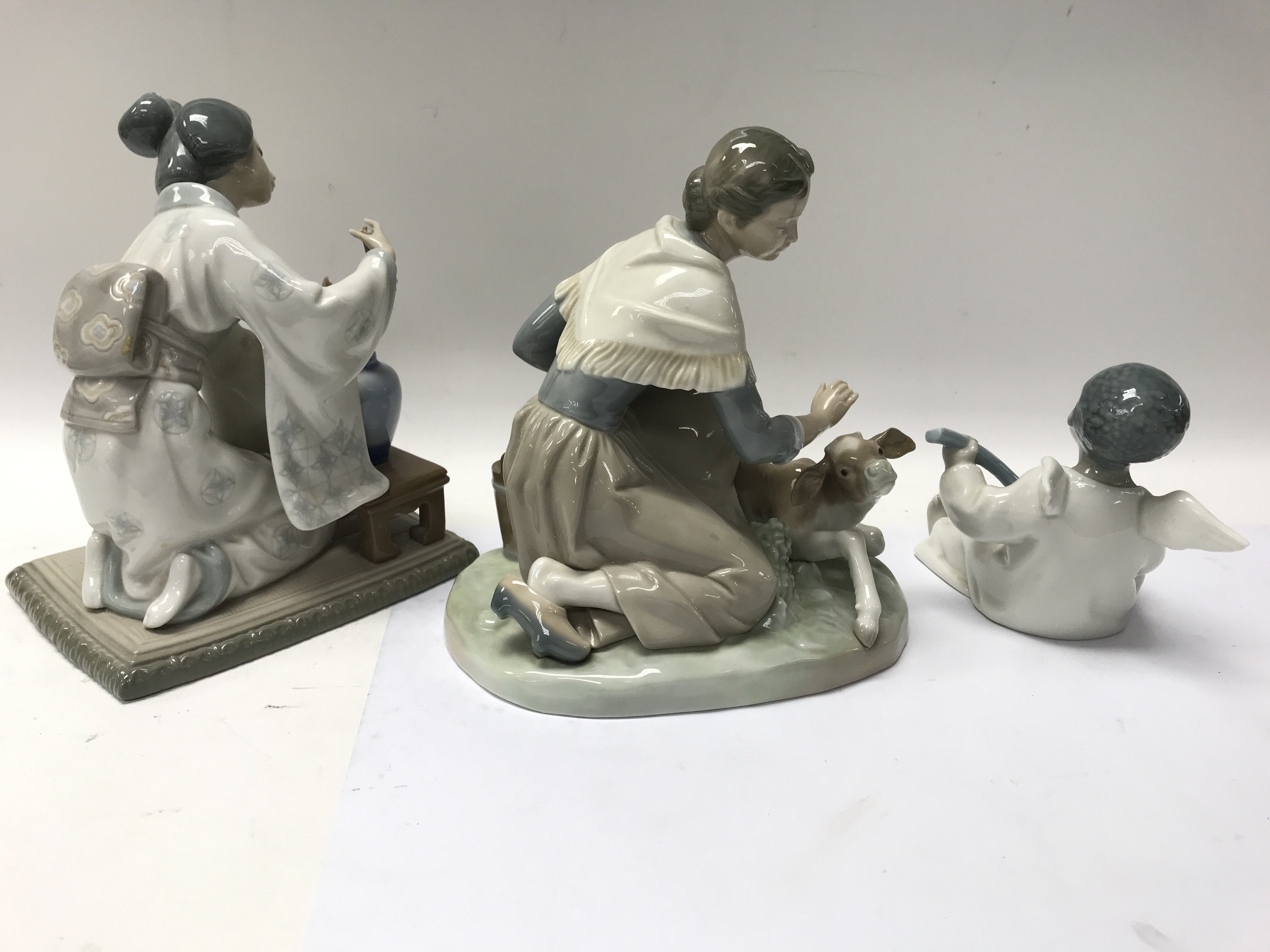 Three Lladro figures including a cherub playing a - Image 2 of 3