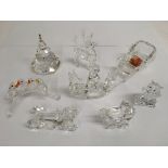 A small group of Swarovski crystal ornaments inclu