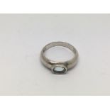 A silver ring set with an aquamarine stone, approx