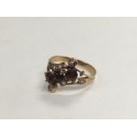 A gold tone Victorian ring set with stones, approx
