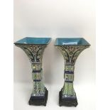 A pair of Chinese pottery vases having square tops