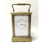 A brass cased carriage clock striking on a gong, m