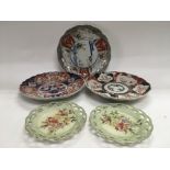 Three Oriental plates of scalloped form plus a sma