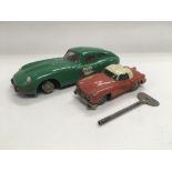A Schuco clockwork tin plate car plus one other (2