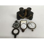 A military compass, pair of binoculars, stopwatch