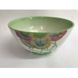 A Clarice cliff bowl decorated with flowers and foilage in pink and green 19 cm slight paint loss