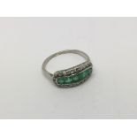 An emerald and diamond ring, approx 2.9g and appro