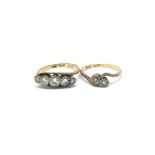 Two 18ct gold ladies rings inset with diamonds. To
