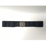 A vintage nurses belt with white metal, possibly s