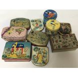 A collection of Walt Disney and other vintage tins and money boxes.