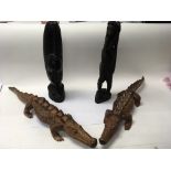 A set of carved African tribal pieces to include t