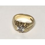 An 18carat gold Gypsy type ring set with a brillia