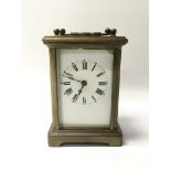 A small brass cased carriage clock with Roman nume
