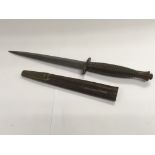 A WW2 Fairburn Sykes commando knife and sheath.