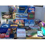 A large collection of boxed board games including