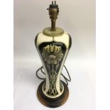 An Art Nouveau style Moorcroft lamp of tapering sh