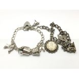 Two silver charm bracelets with heart clasps and w
