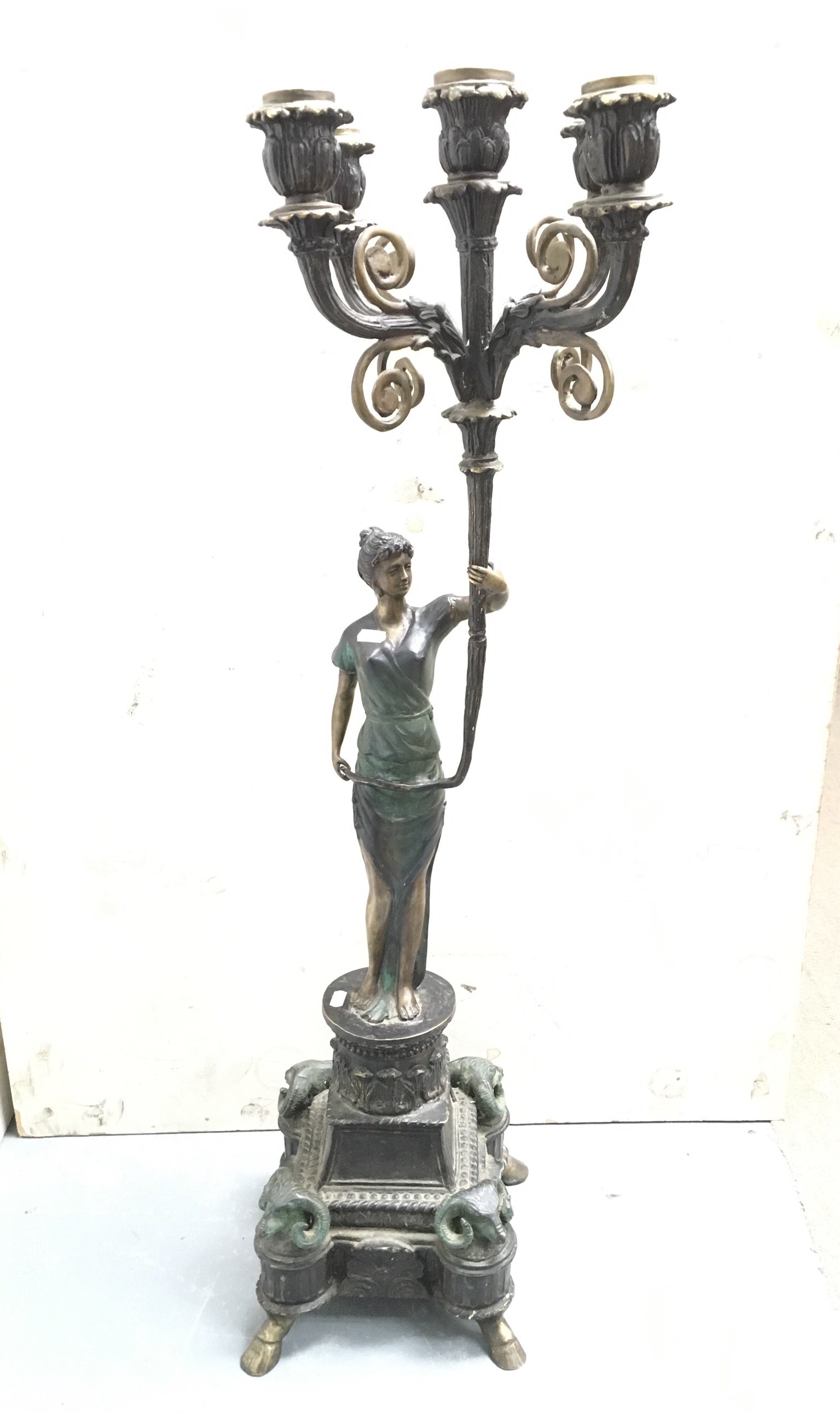 A heavily impressive bronze candelabra of a female