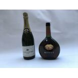 A pair of bottles to include a bottle of Louis Dor