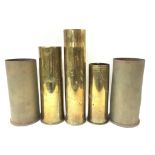 Three World War One brass shell cases and a pair o