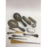 A silver backed brush set plus silver lidded trink