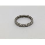 A platinum eternity ring set with small diamonds,