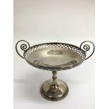 A silver footed tazza with pierced rim and scroll