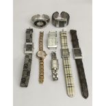 A collection of designer watches including Gucci,