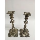 A pair of silver Rococco style candlesticks, Londo