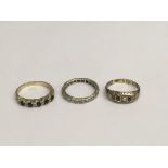 Three gold rings, inset with alternating diamonds