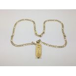 An Eygyptian pendant on a 9ct gold chain, approx 1